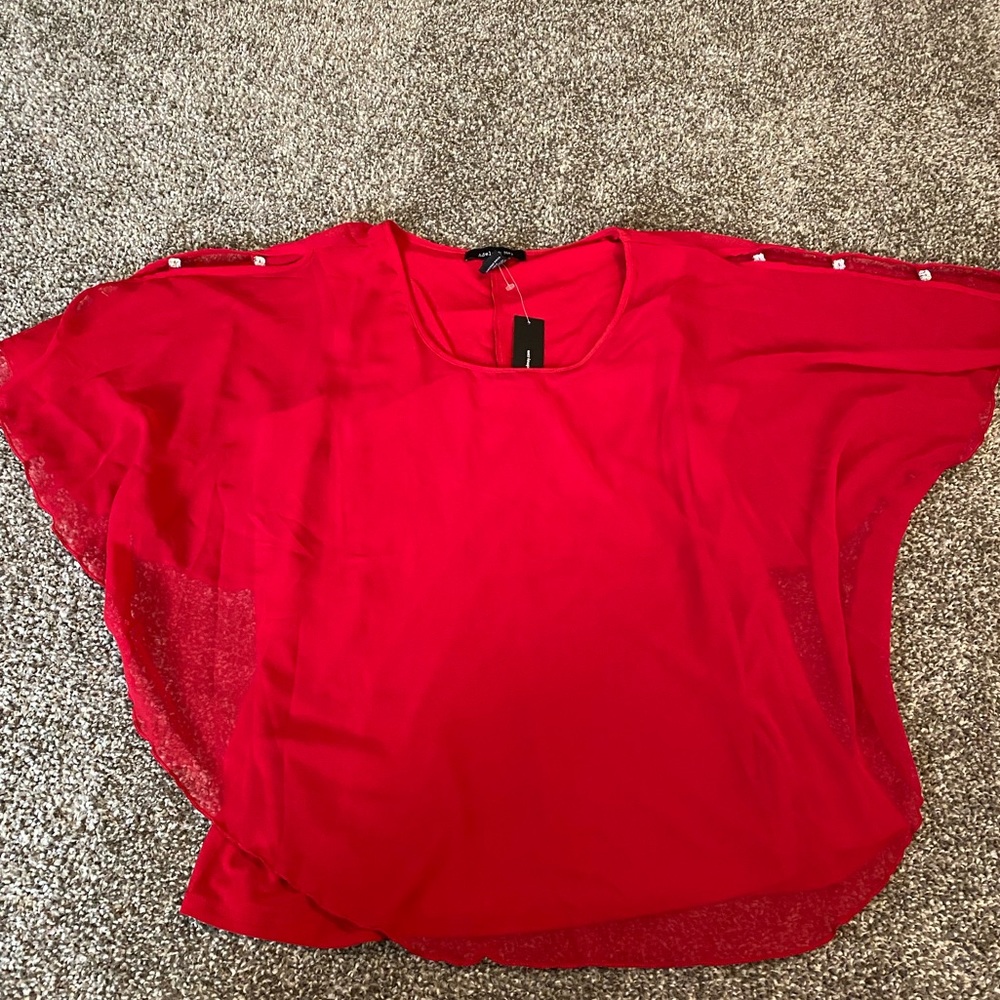 Red flows top with bedazzled shoulders